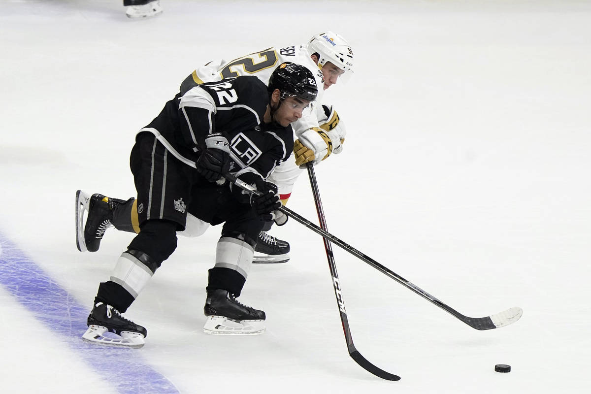 Los Angeles Kings center Andreas Athanasiou (22) works against Vegas Golden Knights left wing T ...