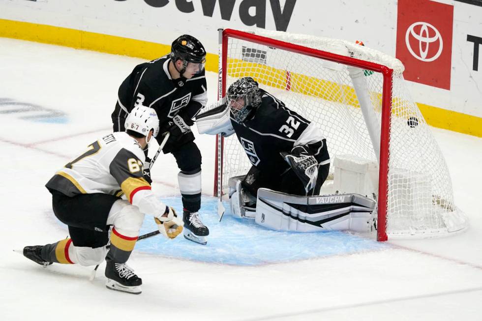 Vegas Golden Knights left wing Max Pacioretty, left, scores past Los Angeles Kings goaltender J ...