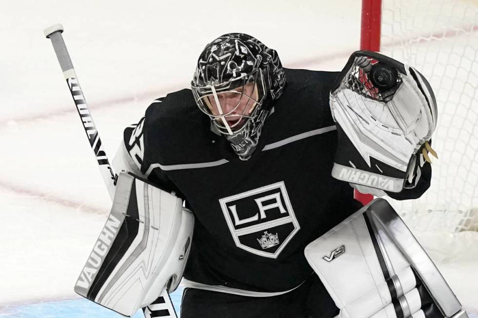 Los Angeles Kings goaltender Jonathan Quick stops a shot during the first period of the team's ...