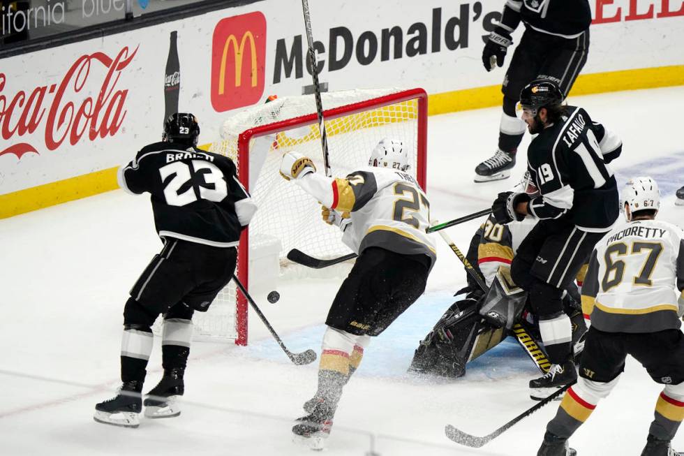 Los Angeles Kings left wing Alex Iafallo, right, scores during the first period of the team's N ...