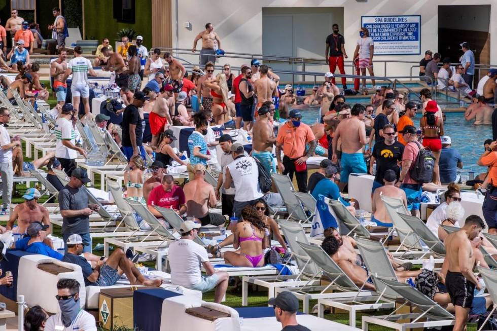 The pools and decks are crowded in Stadium Swim at the Circa on Friday, March 19, 2021. (L.E. B ...
