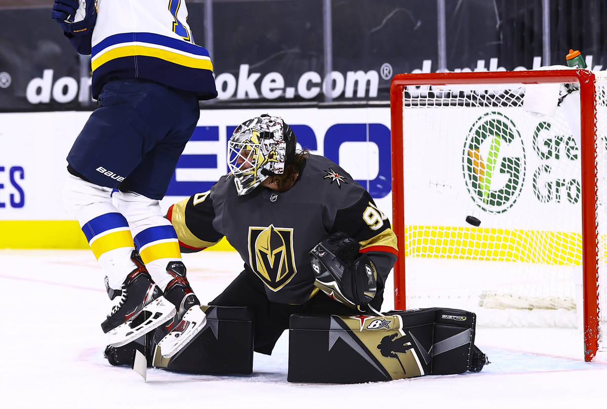 St. Louis Blues left wing Jaden Schwartz (17) jumps to avoid the puck as it flies past Golden K ...