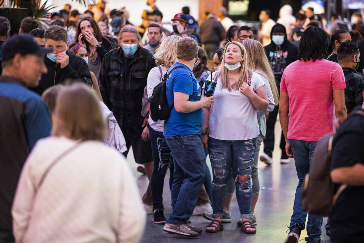 People visit the Fremont Street Experience in Las Vegas, Friday, March 19, 2021. (Erik Verduzco ...