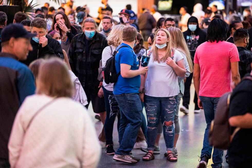 People visit the Fremont Street Experience in Las Vegas, Friday, March 19, 2021. (Erik Verduzco ...