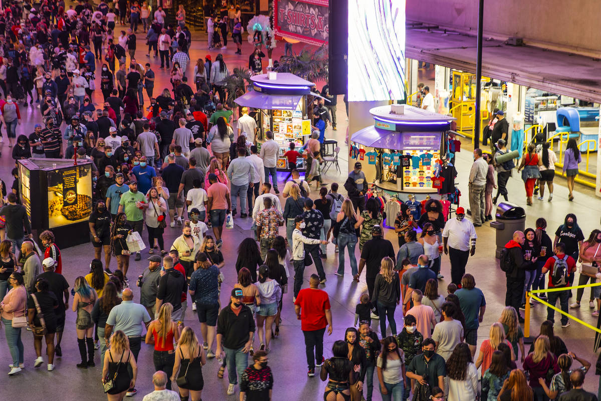 People visit the Fremont Street Experience in Las Vegas, Friday, March 19, 2021. (Erik Verduzco ...