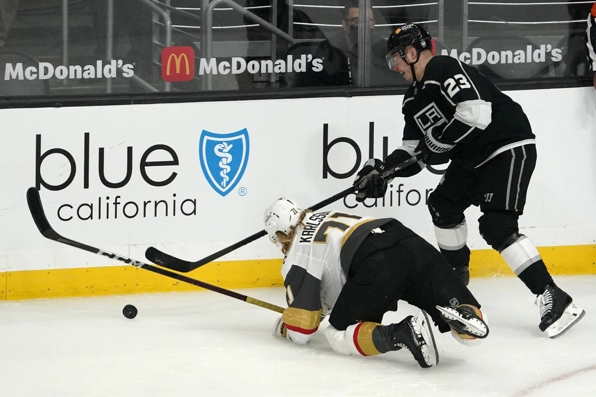 Vegas Golden Knights center William Karlsson, left, falls while under pressure from Los Angeles ...