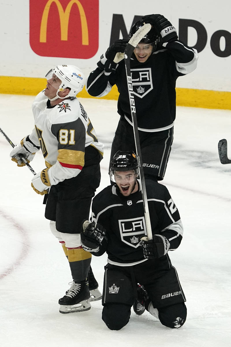 Los Angeles Kings defenseman Sean Walker, below, celebrates his goal along with center Trevor M ...