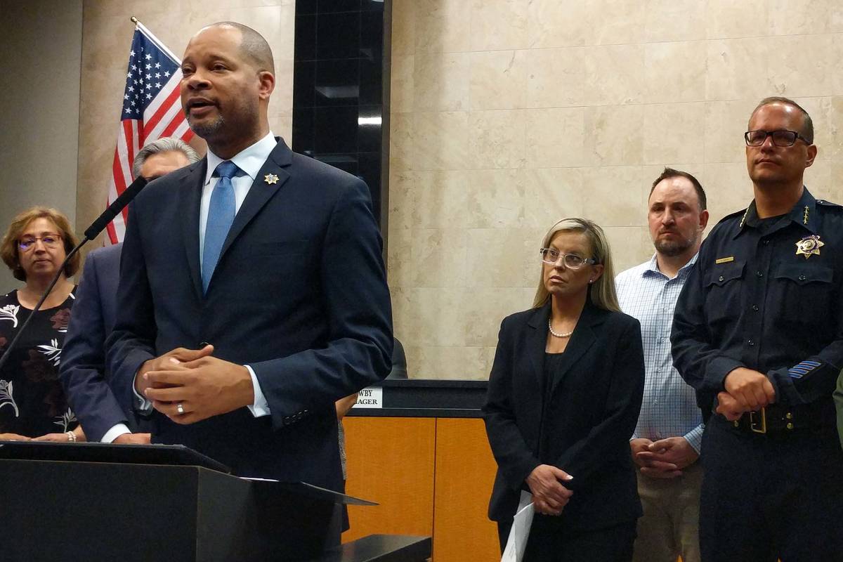 Nevada Attorney General Aaron Ford, left, speaking during a news conference at Reno City Hall o ...