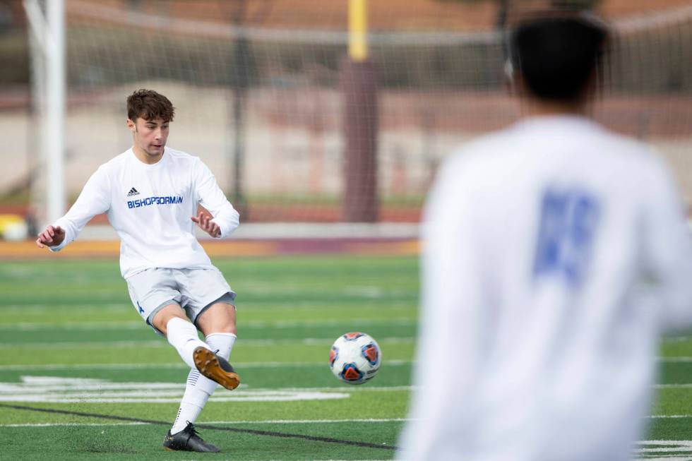 Bishop Gorman defender Keegan Brooks (4) passes the ball during a high school soccer game again ...