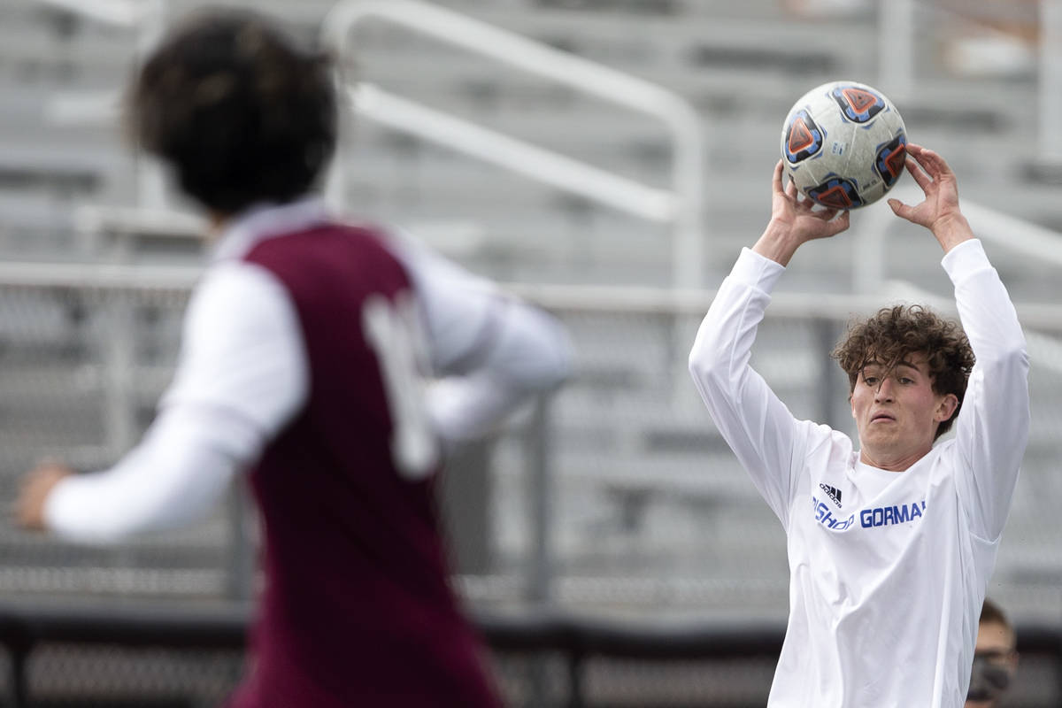 Bishop Gorman defender Daniel Mazzeo (2) passes from the sidelines during their high school soc ...