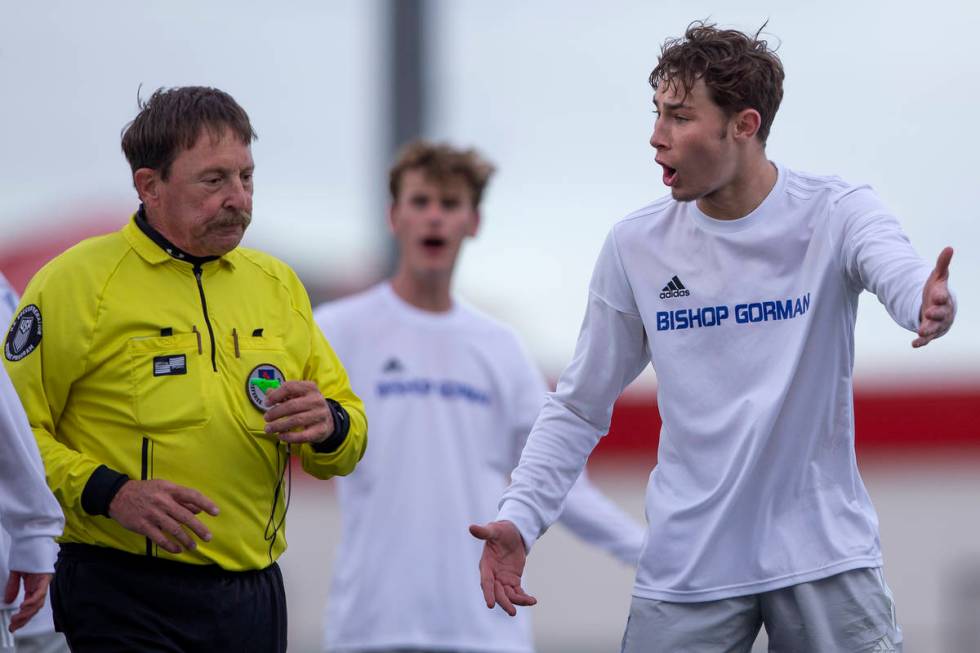 Bishop Gorman defender Keegan Brooks (4), right, argues with a referee about a call made during ...