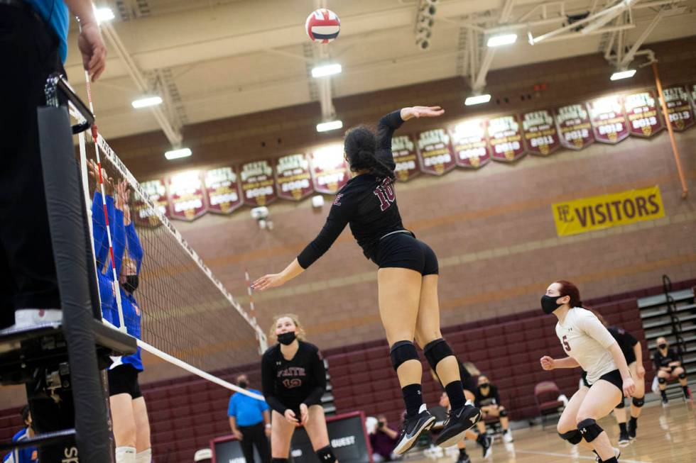 Faith Lutheran's Isabelle Guerrero (10) jumps to spike at Bishop Gorman during their girls high ...