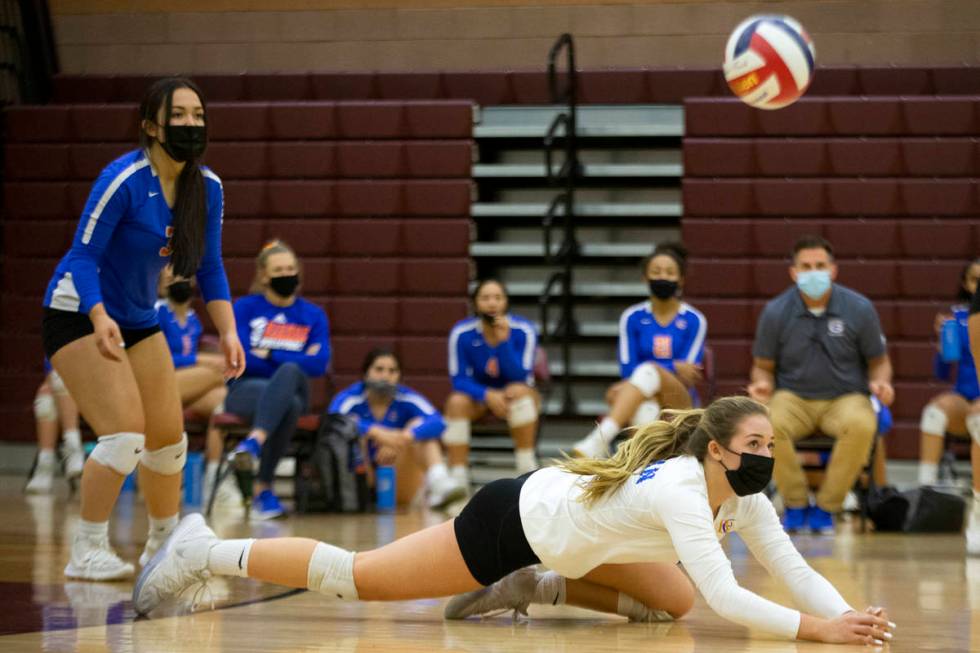 Bishop Gorman's Morgan Mixer (2) watches her dive shot during a girls high school volleyball ga ...