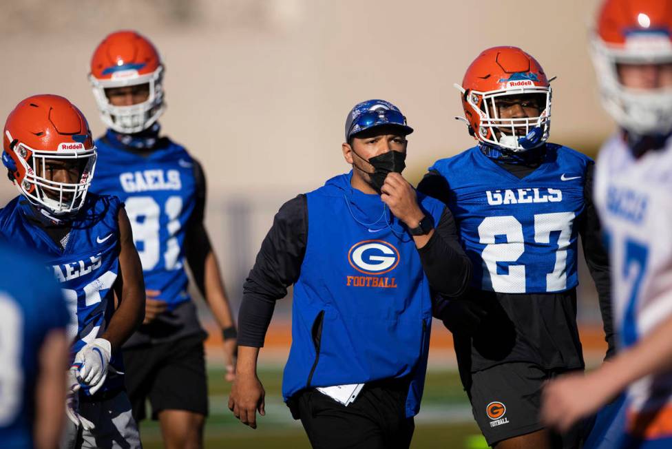 Bishop Gorman head football coach Brent Browner, middle, leads practice on Friday, Feb. 19, 202 ...