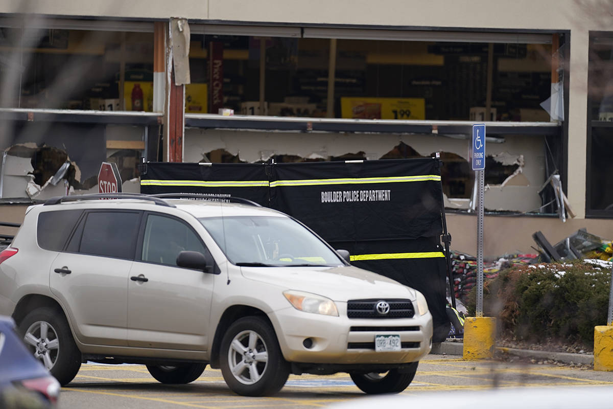 Windows appear damaged at a King Soopers grocery store where a shooting took place Monday, Marc ...