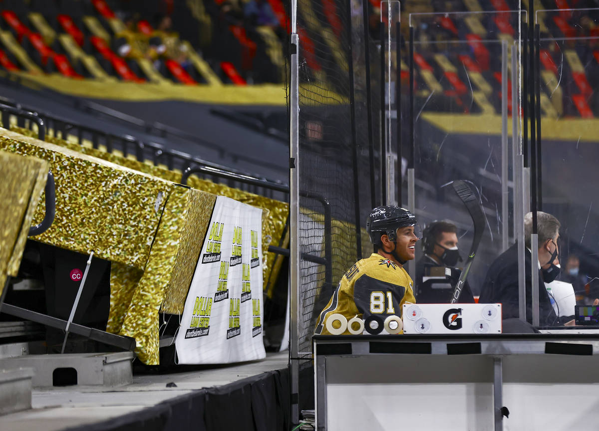 Golden Knights' Jonathan Marchessault watches the action from the penalty box during the first ...