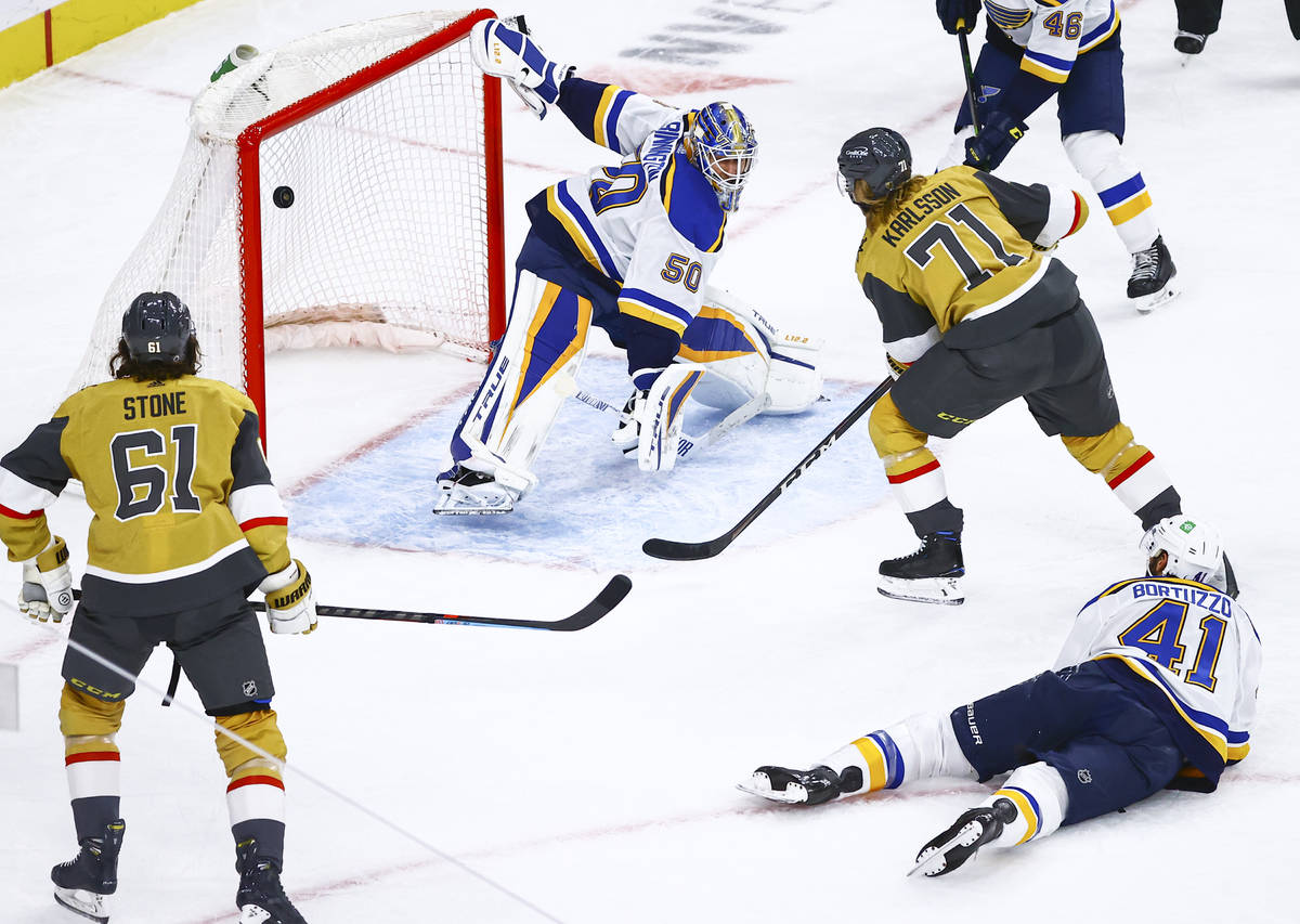 Golden Knights' William Karlsson (71) scores against St. Louis Blues goaltender Jordan Binningt ...