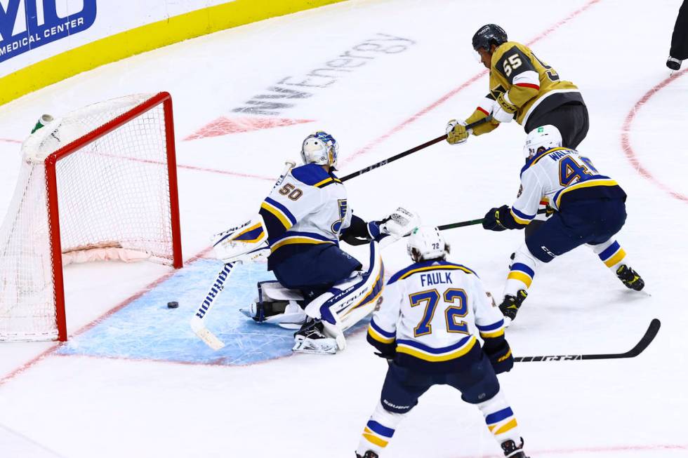 Golden Knights' Keegan Kolesar (55) scores his first NHL goal against the St. Louis Blues durin ...