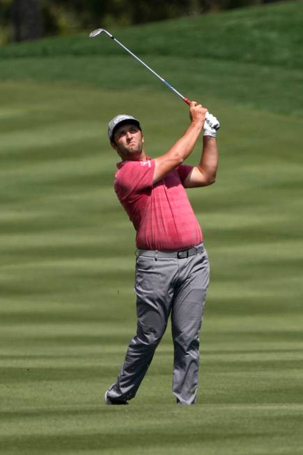 Jon Rahm his a shot from the second fairway during the final round at The Players Championship ...