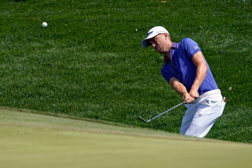 Justin Thomas chips during the final round at The Players Championship golf tournament Sunday, ...