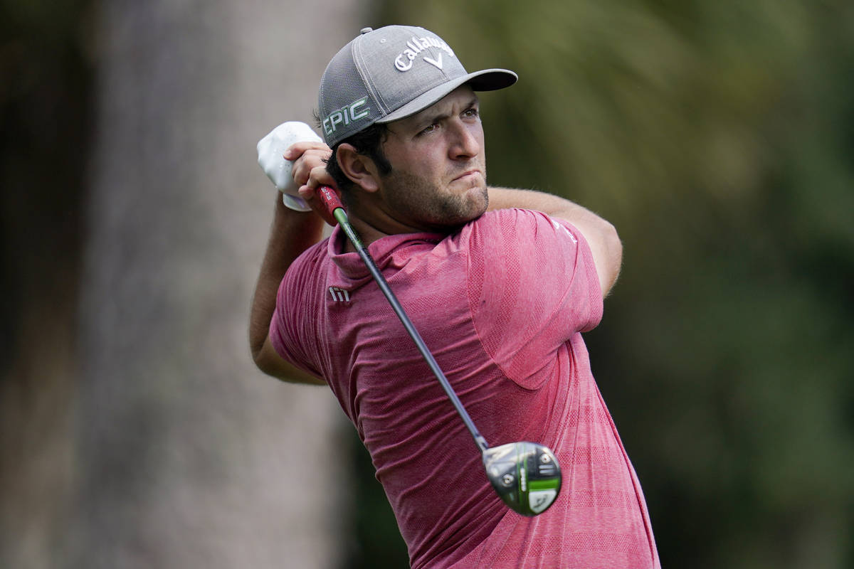 Jon Rahm, of Spain, watches his tee shot on the second hole during the final round of The Playe ...