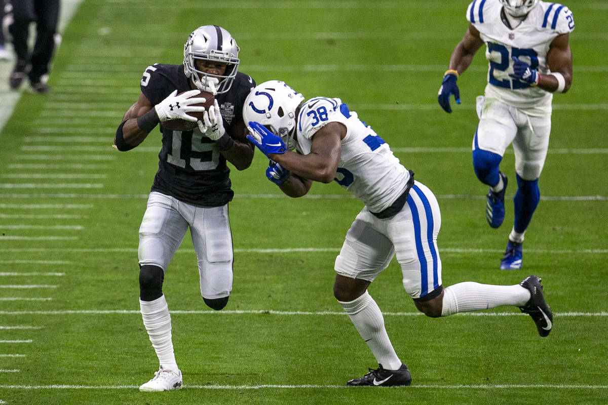 Raiders wide receiver Nelson Agholor (15) makes a catch as Indianapolis Colts cornerback T.J. C ...