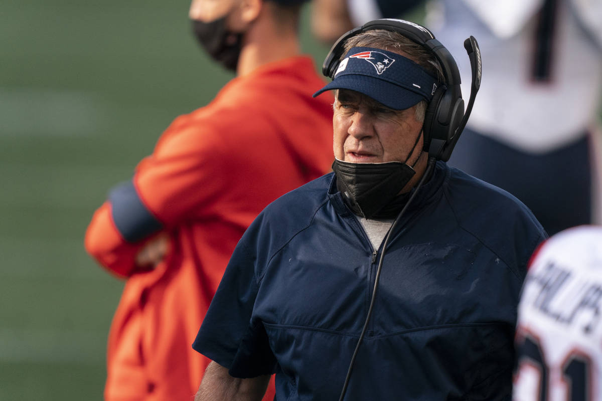 New England Patriots head coach Bill Belichick is pictured on the sideline before an NFL footba ...