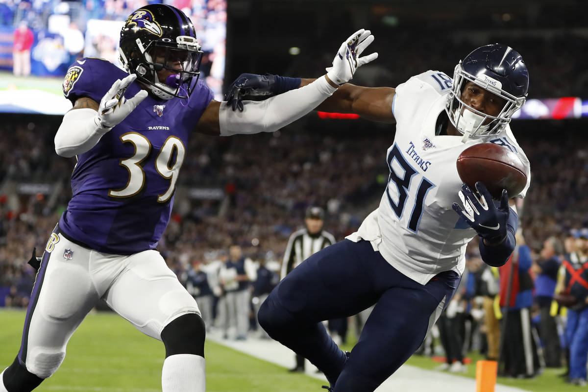 FILE - Tennessee Titans tight end Jonnu Smith (81) makes a touchdown catch against Baltimore Ra ...
