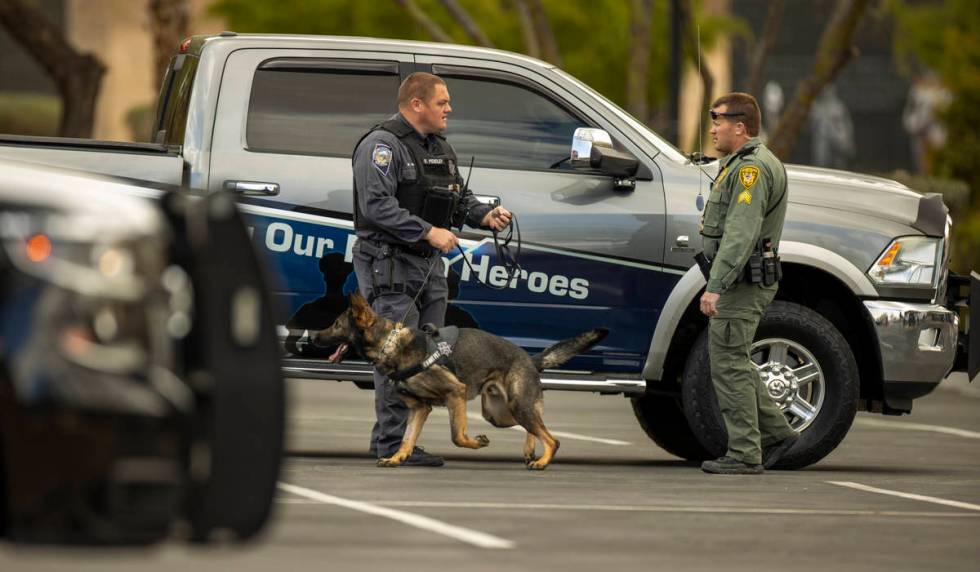 Emergency personnel work at the scene as a suspicious item on the ground is investigated at the ...