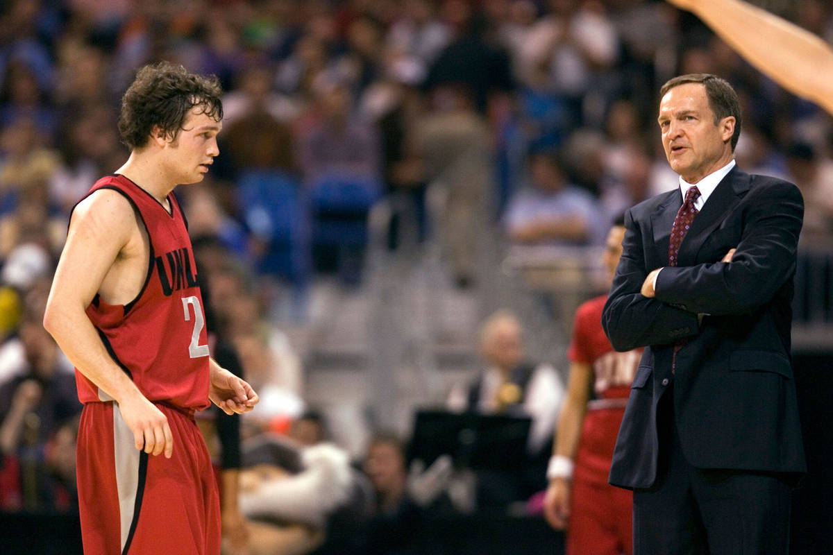 UNLV point guard Kevin Kruger looks to his father Lon Kruger as Oregon takes a free throw in th ...