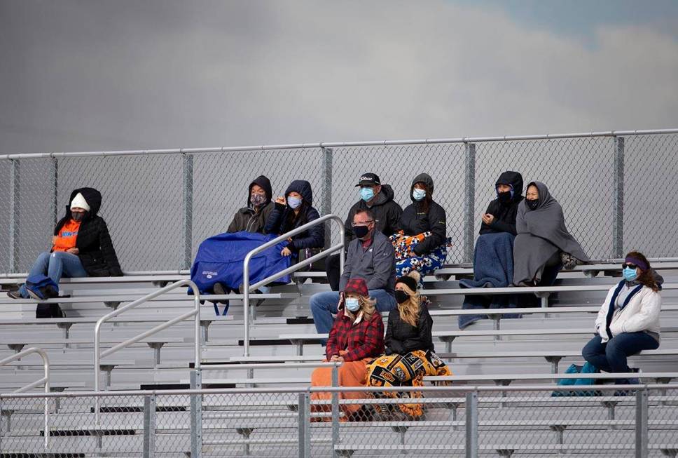 Bishop Gorman fans are dressed for cold weather while watching the boys varsity high school soc ...