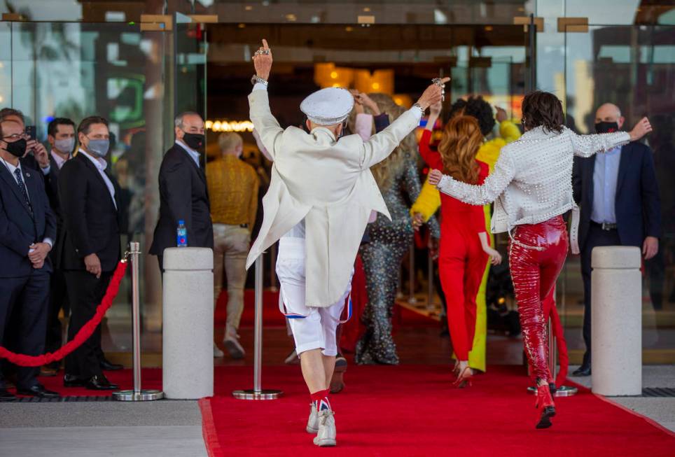 Dancers move up the red carpet and into the venue during the Virgin Hotels Las Vegas opening ce ...