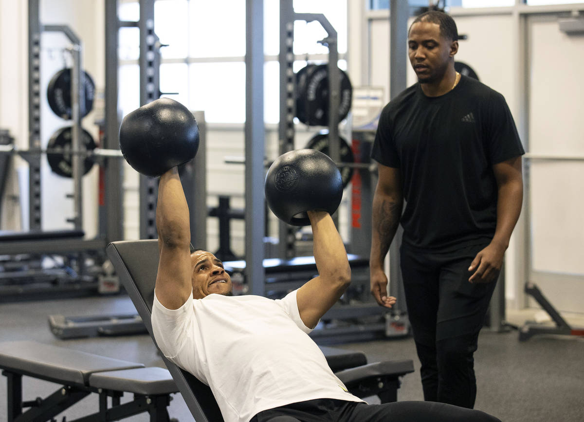 Las Vegas Raiders safety Johnathan Abram works out with Deon Hodges, human performance speciali ...