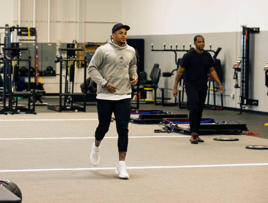 Las Vegas Raiders safety Johnathan Abram warms up before his workout with Deon Hodges, right, h ...