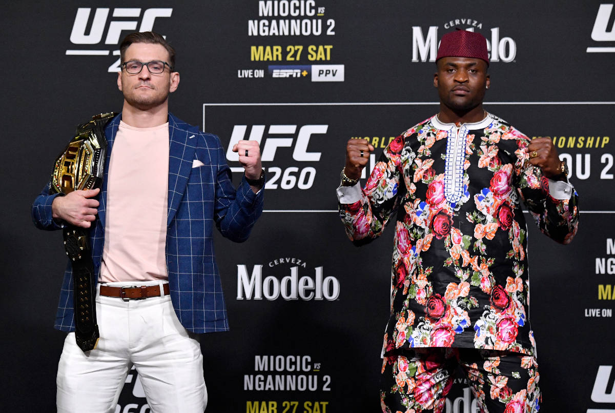 Opponents Stipe Miocic and Francis Ngannou of Cameroon pose for photos during the UFC 260 press ...