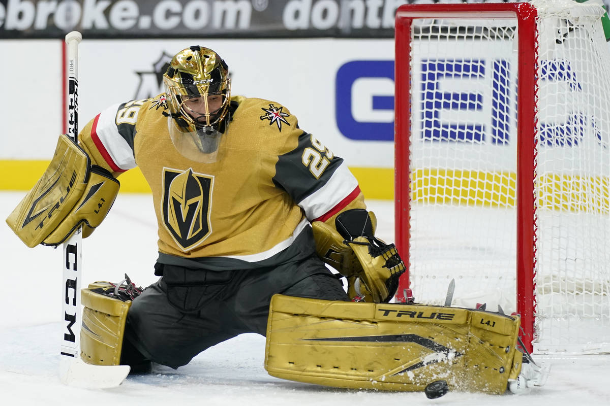 Vegas Golden Knights goaltender Marc-Andre Fleury (29) deflects the puck during the first perio ...