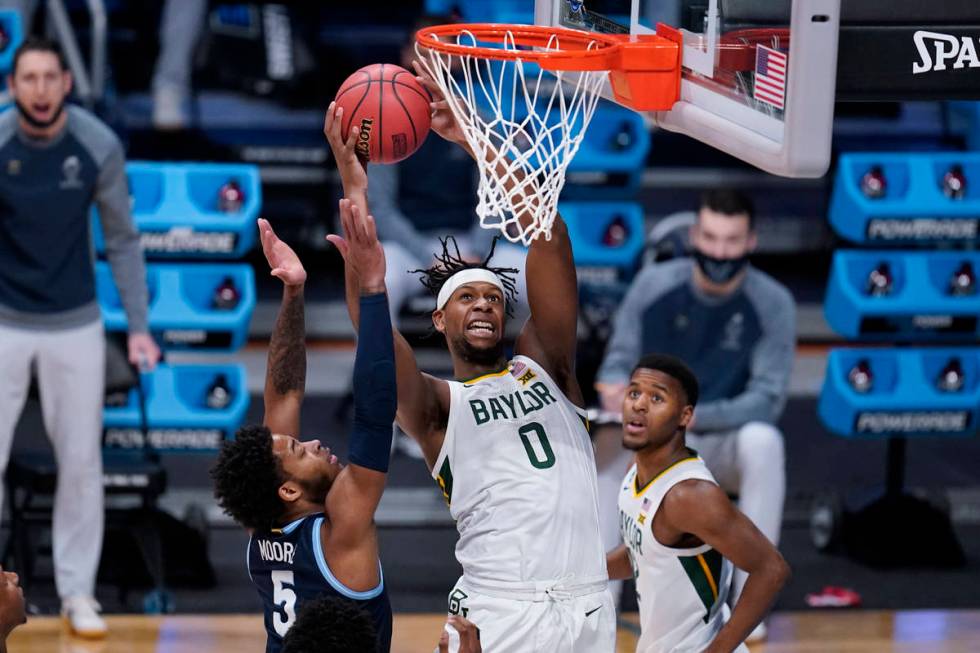 Baylor forward Flo Thamba (0) drives on Baylor guard Jordan Turner (5) in the first half of a S ...