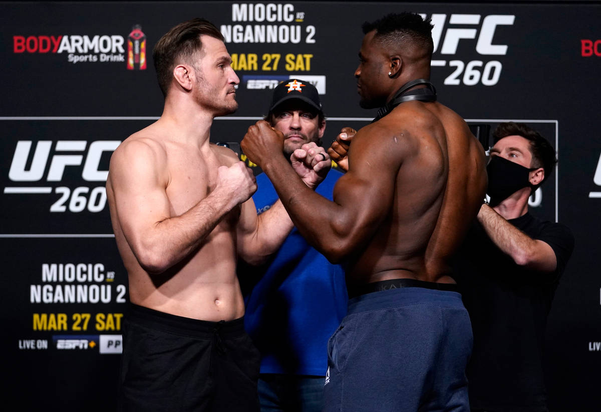 Opponents Stipe Miocic and Francis Ngannou of Cameroon face off during the UFC 260 weigh-in at ...