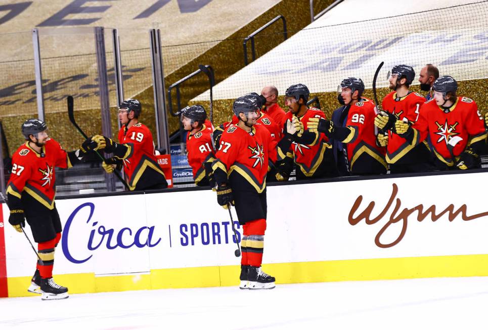 Golden Knights' Max Pacioretty (67) celebrates his goal with teammates during the first period ...