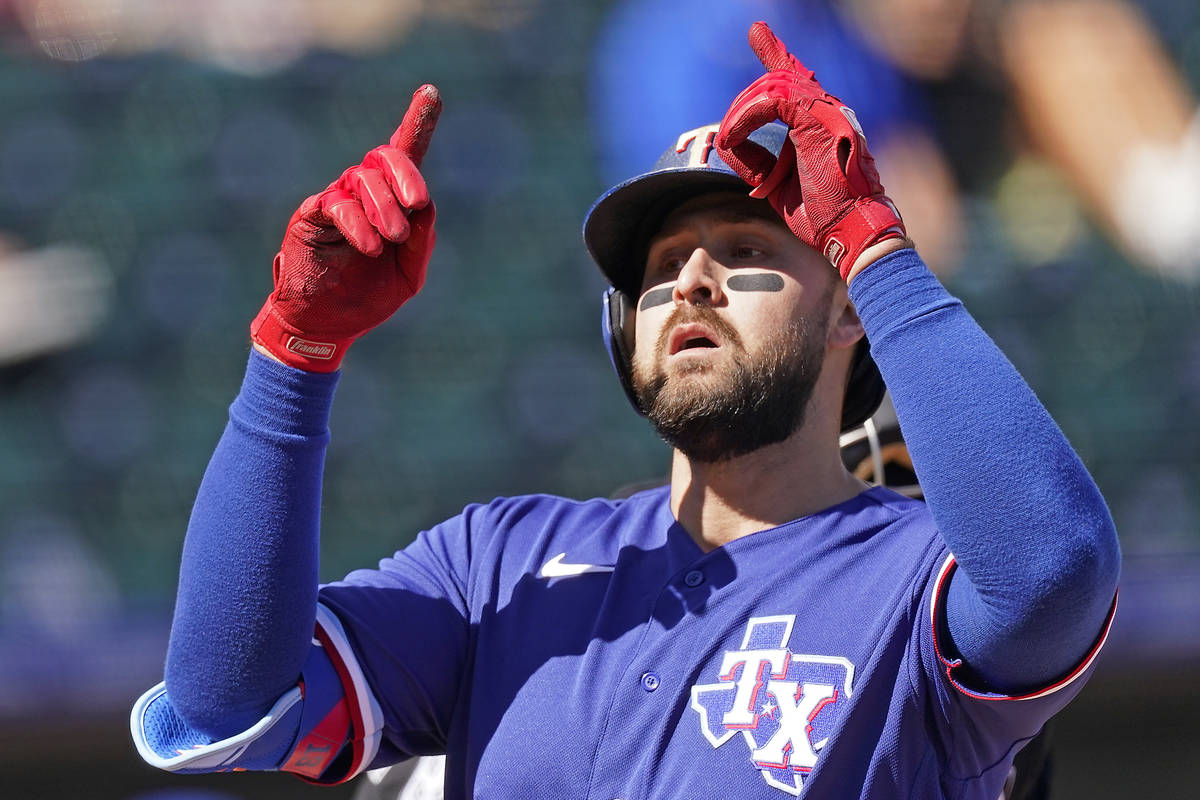 Texas Rangers' Joey Gallo celebrates as he crosses the plate after hitting a two-run home run d ...