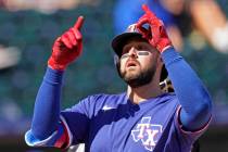 Texas Rangers' Joey Gallo celebrates as he crosses the plate after hitting a two-run home run d ...