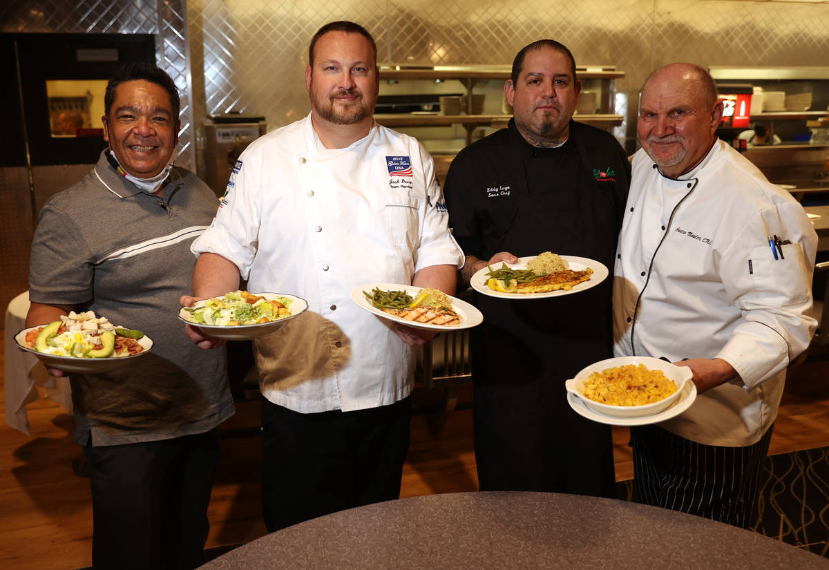 Food and Beverage Manager Chris Sjafiroeddin with the Cobb Salad, from left, Chef Josh Devon wi ...