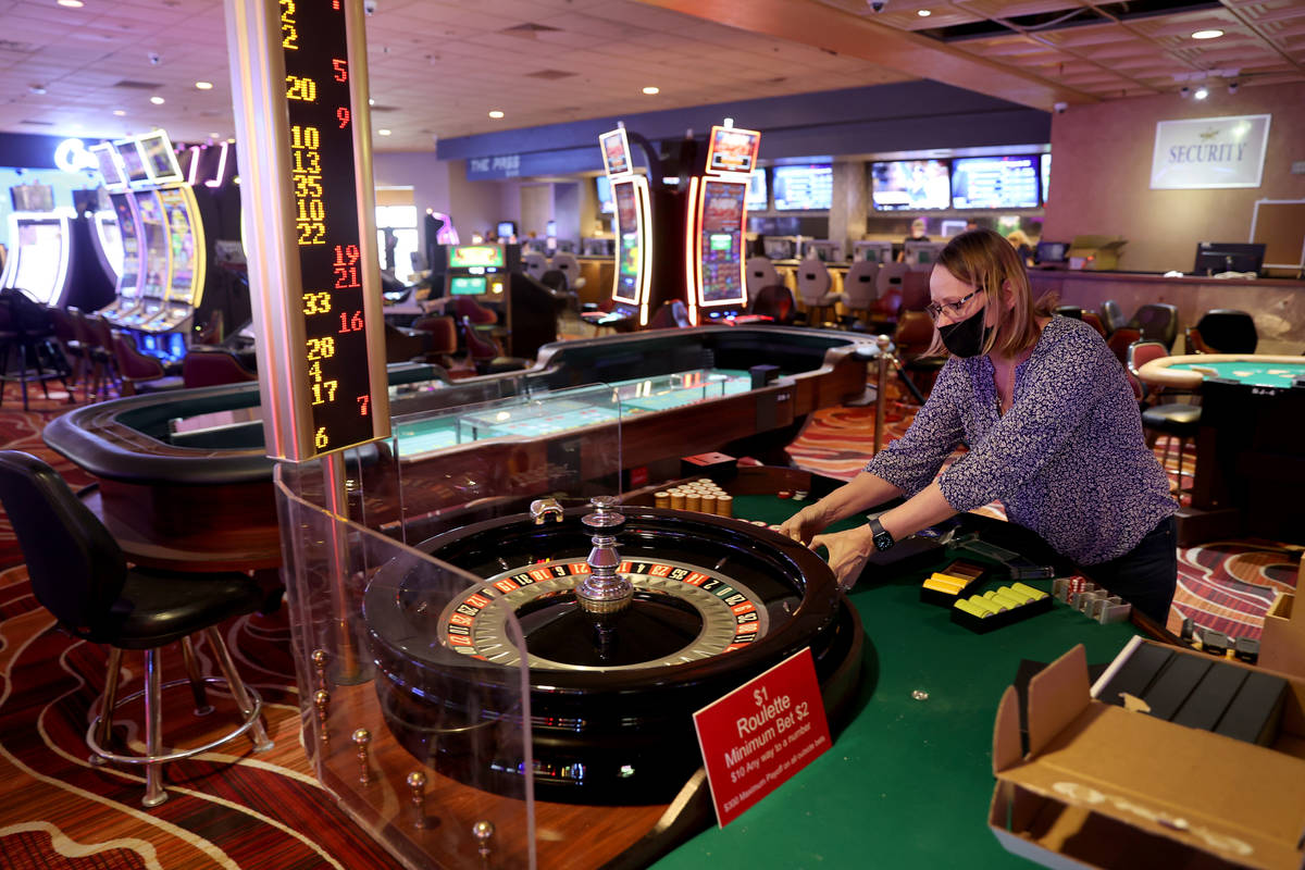 Casino Manager Rhonda Westfall sets up roulette chips at The Pass on historic Water Street in d ...
