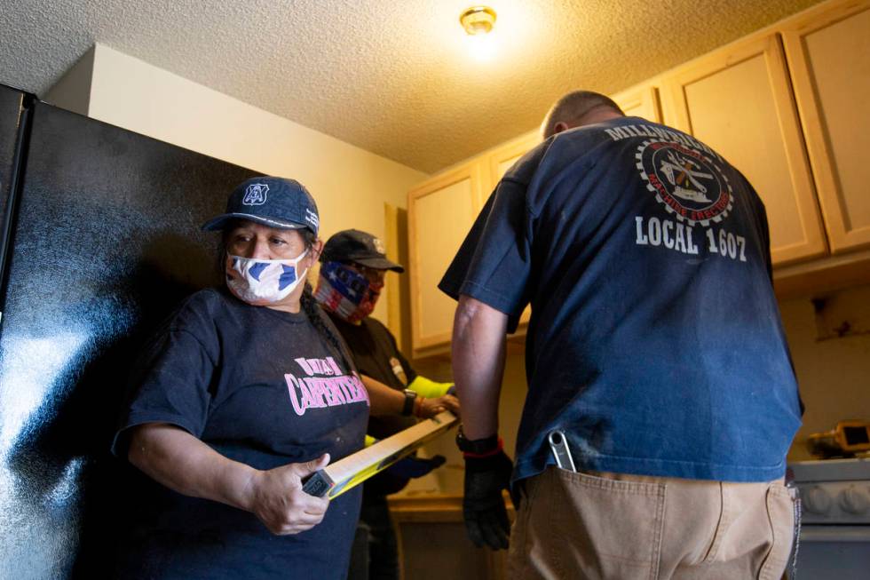 Carpenters Roxana Callender, left, Brandon Morris and Dough Lockhart remodel remodel a homeless ...