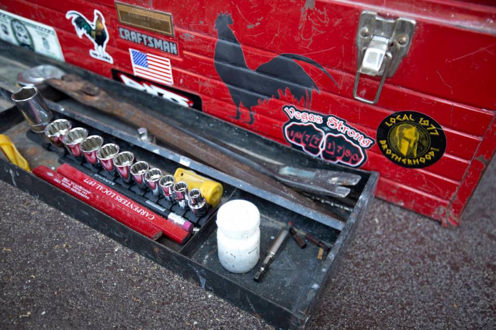 A toolbox is decorated with union stickers and patriotic symbols as carpenters from the Local 1 ...