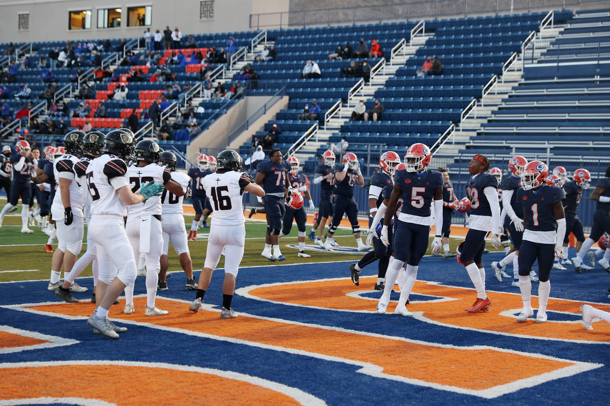 Players with Bishop Gorman and Faith Lutheran taunt each other before the start of their footba ...