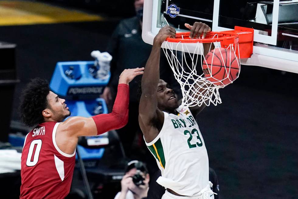 Baylor forward Jonathan Tchamwa Tchatchoua (23) dunks on Arkansas forward Justin Smith (0) duri ...