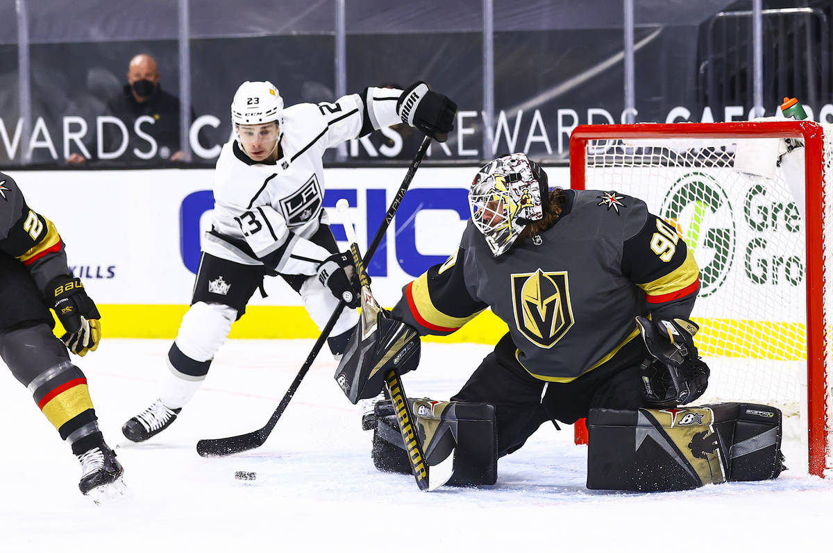 Golden Knights goaltender Robin Lehner (90) looks to block a shot from Los Angeles Kings Dustin ...