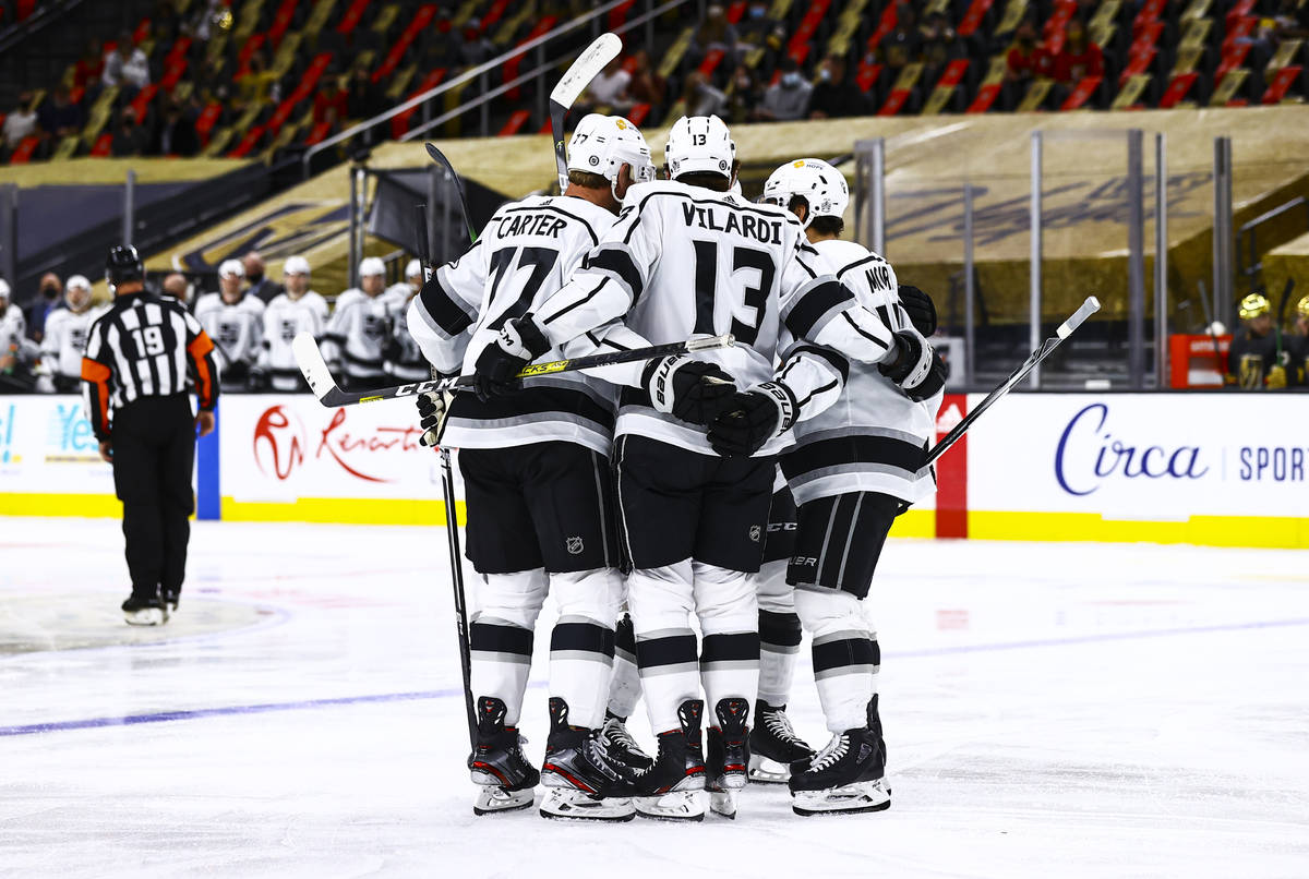 The Los Angeles Kings celebrate a goal against the Golden Knights during the first period of an ...