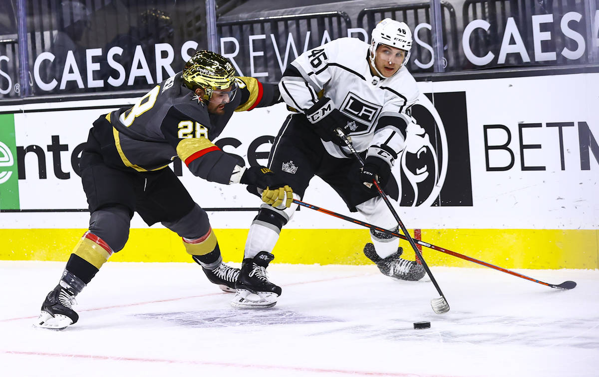 Los Angeles Kings' Blake Lizotte (46) looks to pass the puck under pressure from Golden Knights ...
